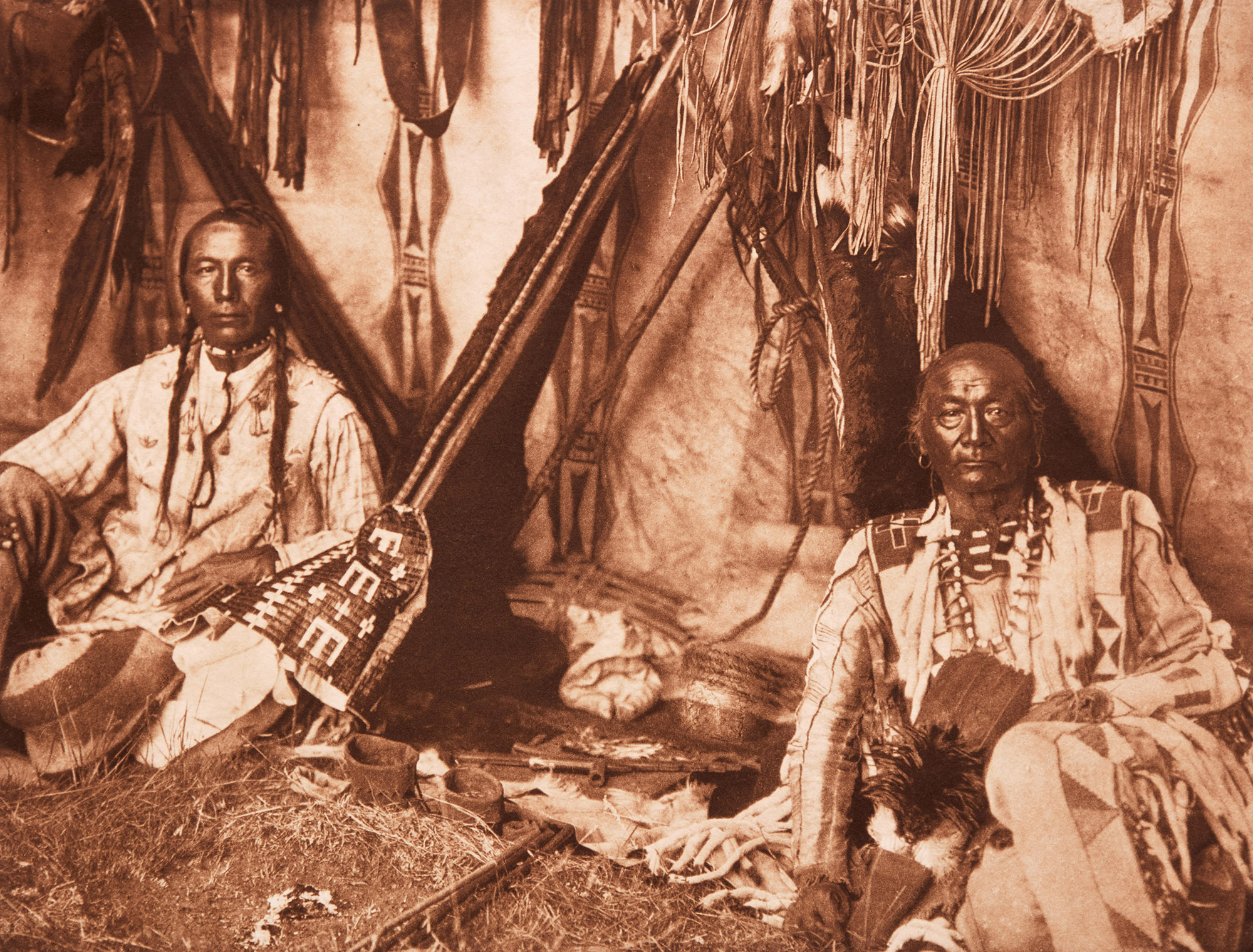 In a Piegan Lodge and Apsaroke War Group by Edward S. Curtis